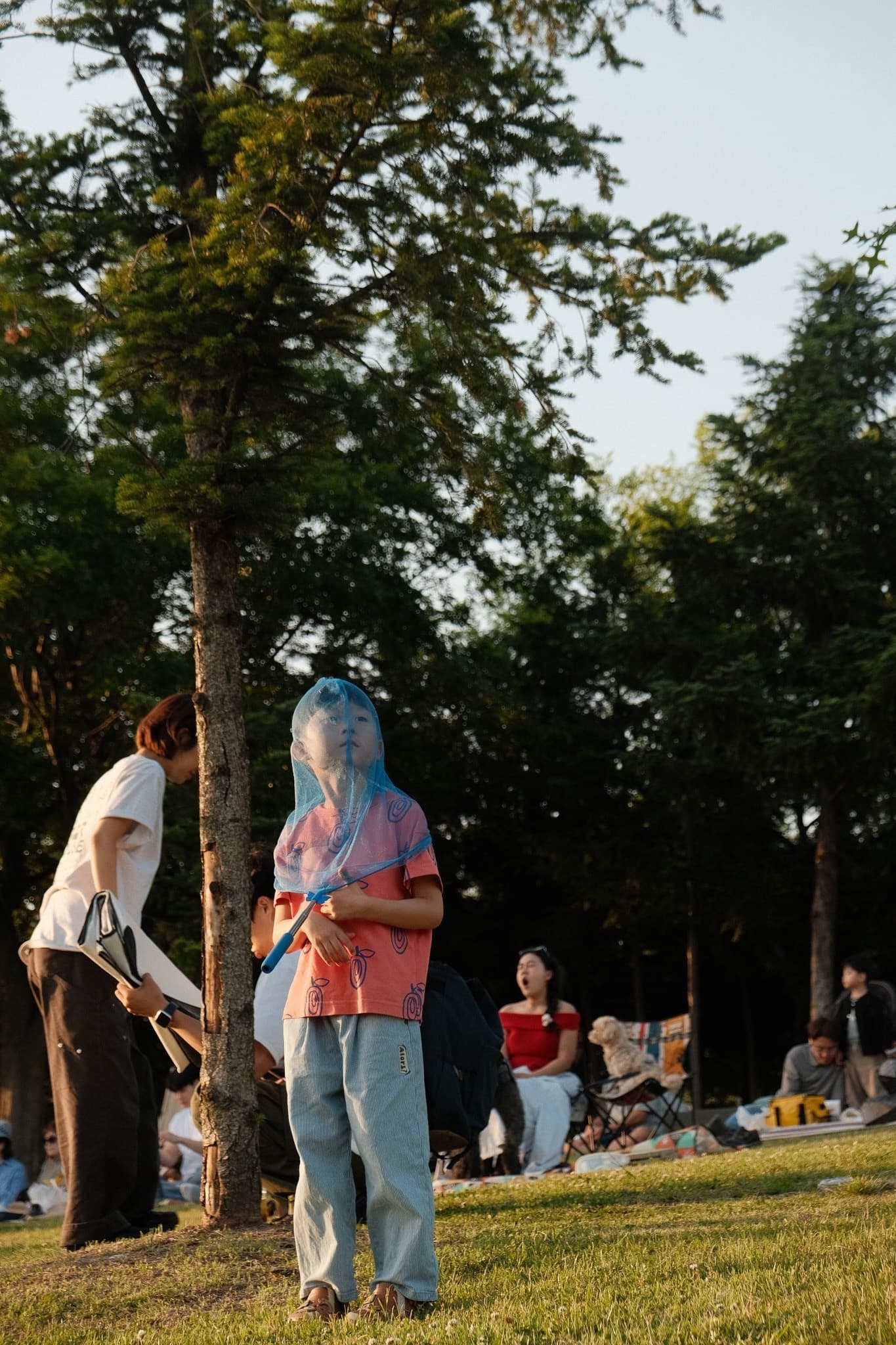 A child at a summer gathering